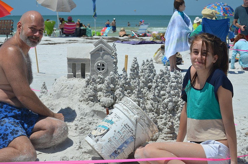 Erin and Ken Shields with their sculpture.