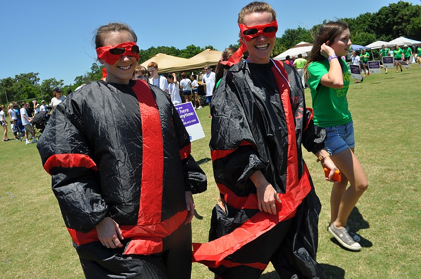 Fifth Third Bank team members Ashley Marcotte and Kathleen Oelberg generate excitement for the sumo contest later that day.