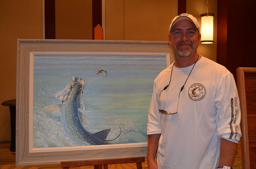 Artist Brendan Coudal with his work.