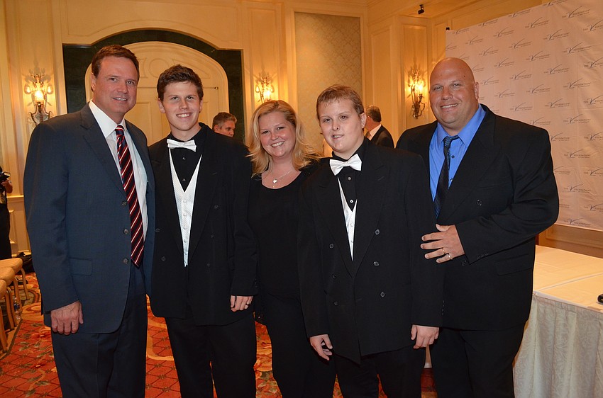 University of Kansas head menâ€™s basketball coach Bill Self with Cody, Denise, Dillon and Shawn Simmons