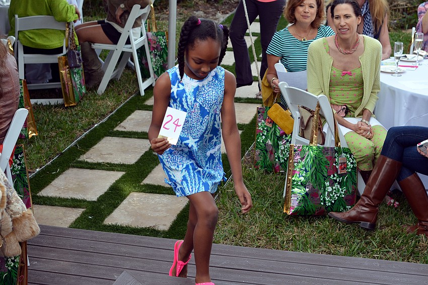 Models fashioned in the latest looks by Lilly Pulitzer walked the runway at the Lilly Pulitzer High Tea & Champagne Fashion Show.