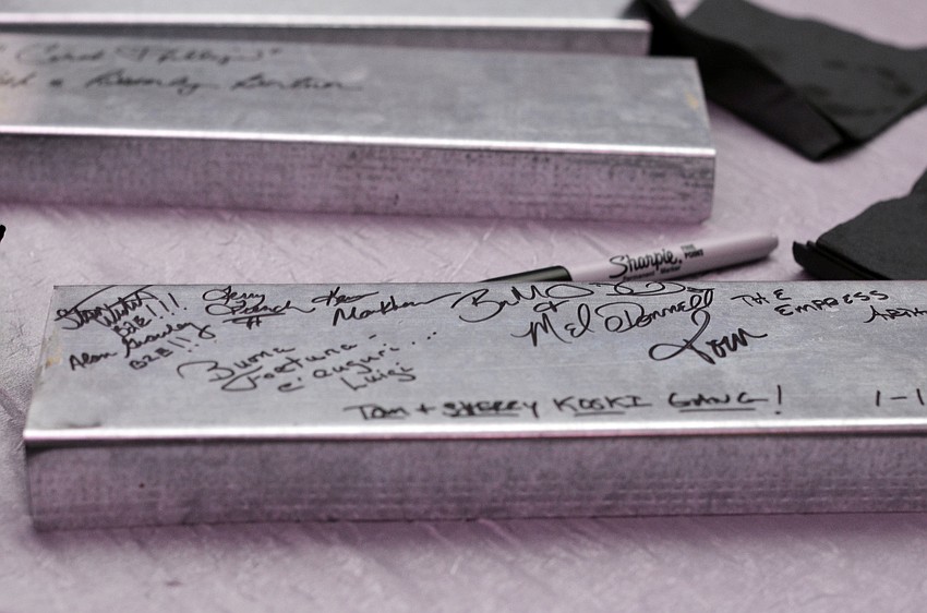 Guests signed steel beams that will be used in the construction of SMOA.