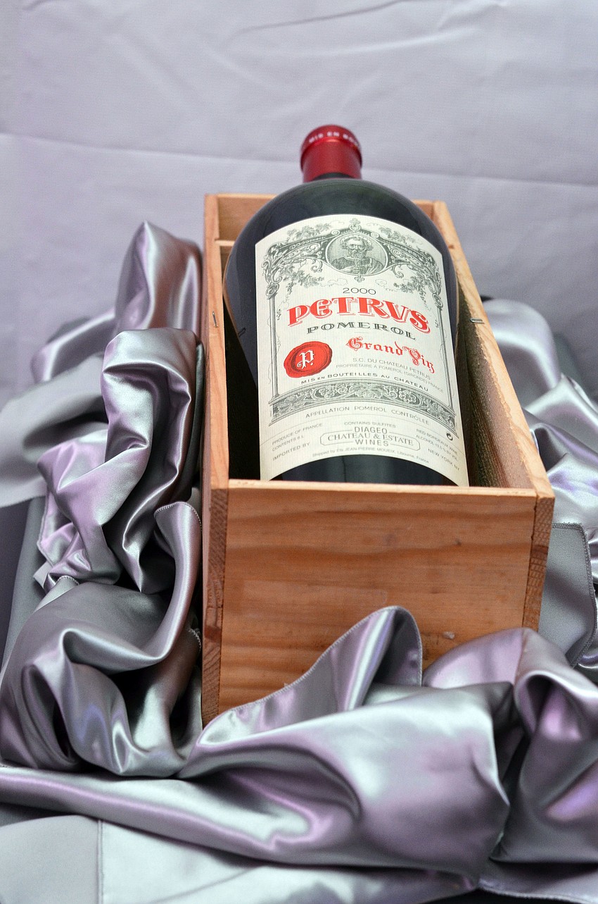 Items such as this Chateau Petrus, Millenium year, six liter, were offered as auction items at The Bash.