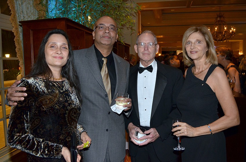 Flavia and Eugene Pereira with Marty and Barbara Bowling