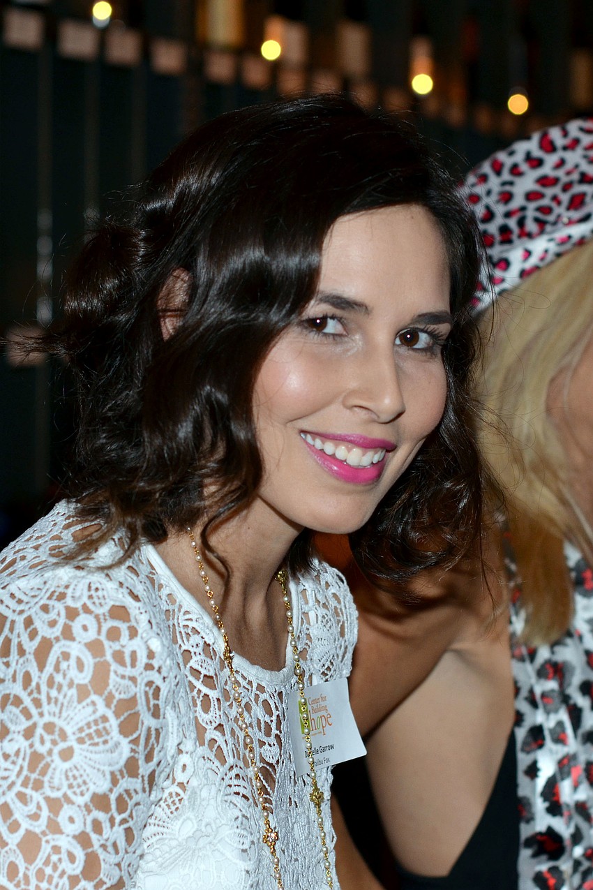 Danielle Garrow behind the bar at Fashionistas for a Cause.