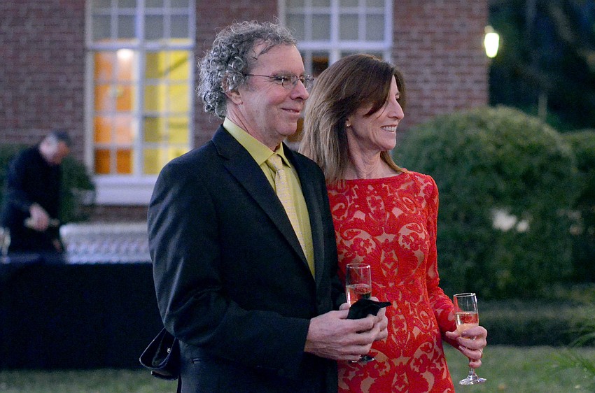 Guests pose to get their photo taken at The Palm Ball â€˜A Passion for Conservation.â€™