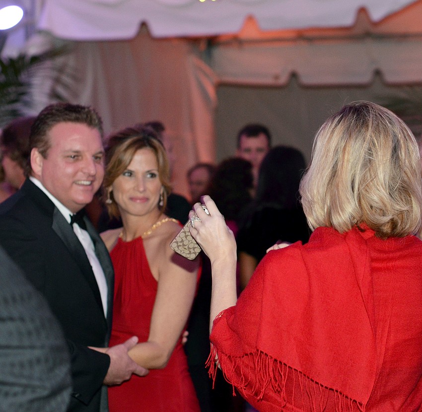 Guests pose for a photo at The Palm Ball â€˜A Passion for Conservation.â€™