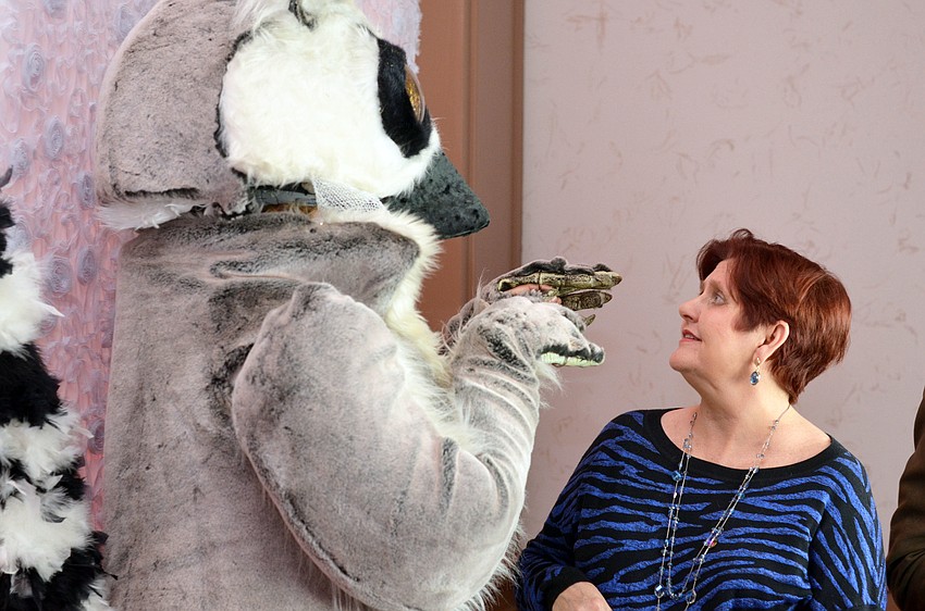 Gayle Guynup with a lemur character at An Evening of Lemur Love.