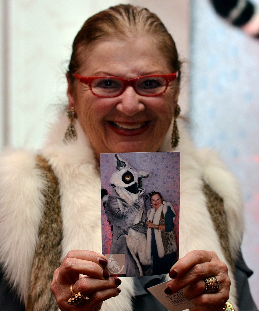 Renee Hamad gets her photo taken with a lemur character at An Evening of Lemur Love.