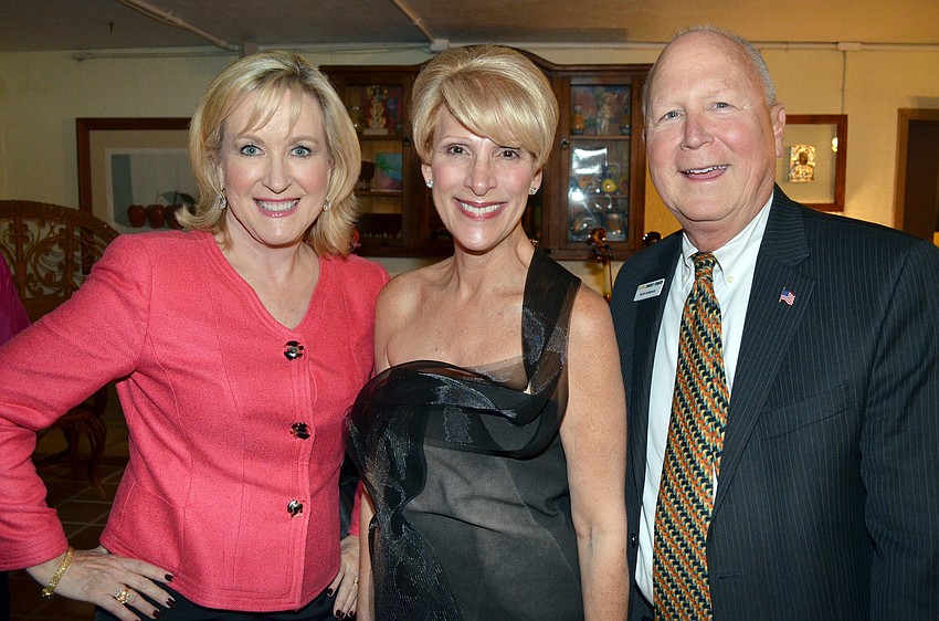 Teri Hansen, co-chair and host Delin Bru and Scott Anderson