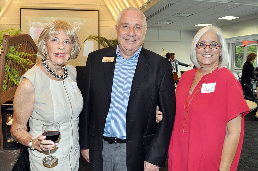 Gloria Moss, honoree Thomas Buchter and Carmen Baskind
