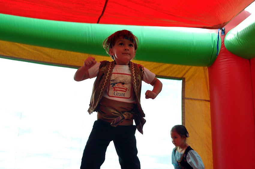 Grant Luzier having a great time in the jump house