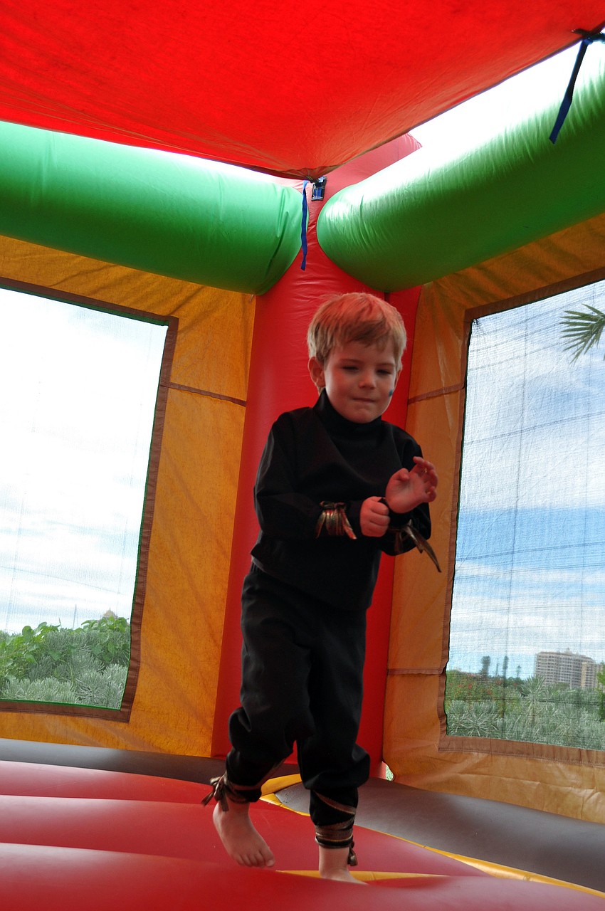 Rhys Parry jumps in the jump house.