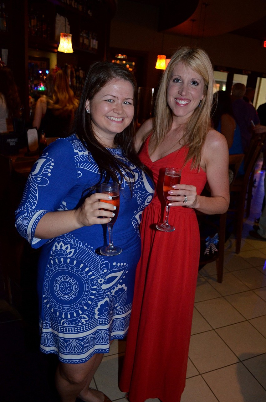 Erika Lisch and Meredith Stauter toast to a fun night.