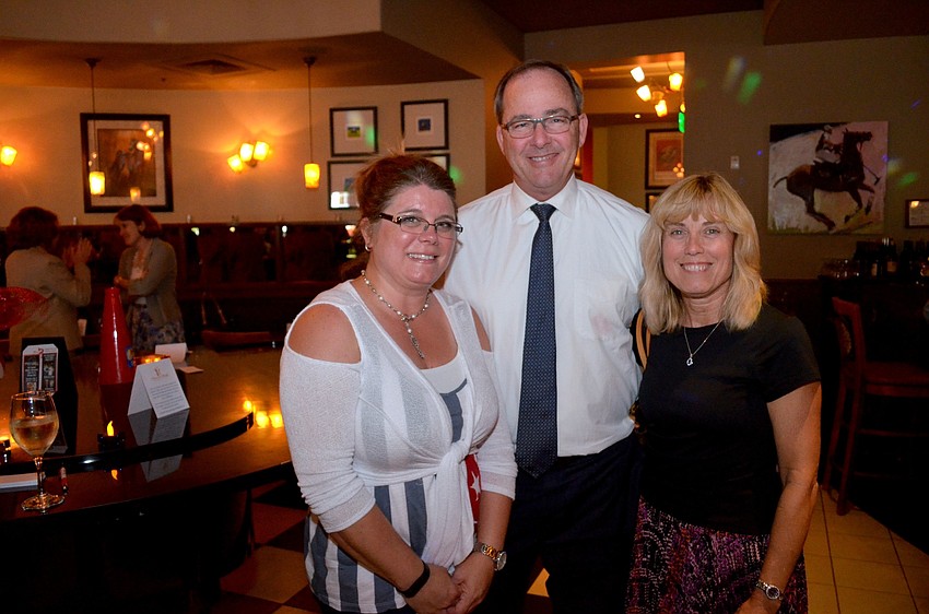 Christy Cardillo and Byron and Jody Shinn support their daughter-in-law, Janel, who was an event co-organizer.