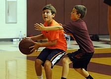 Tara Elementary fifth-grader Ty Moore and Braden River Elementary fourth-grader Carter Jula enjoyed playing one-on-one.
