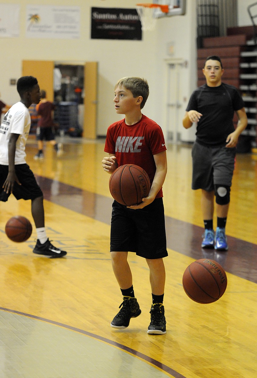 Brett Thoma sizes up his shot during the final day of camp.