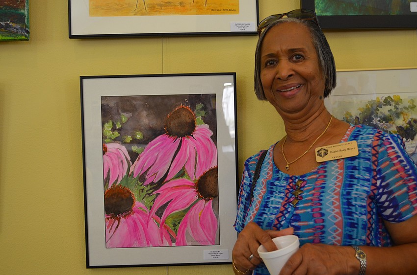 Doriel Rock Boyce with one of her paintings.