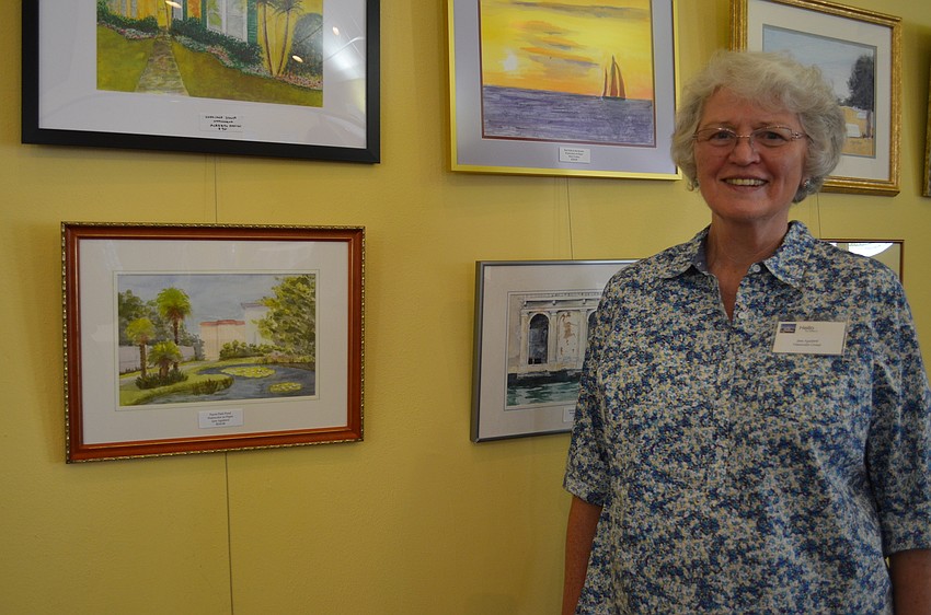 Jane Aguilard with her painting 