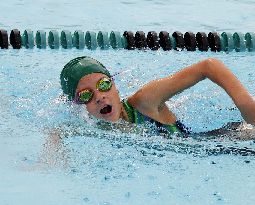 Nine-year-old Abby Loefgren won her heat of the 100-yard freestyle.