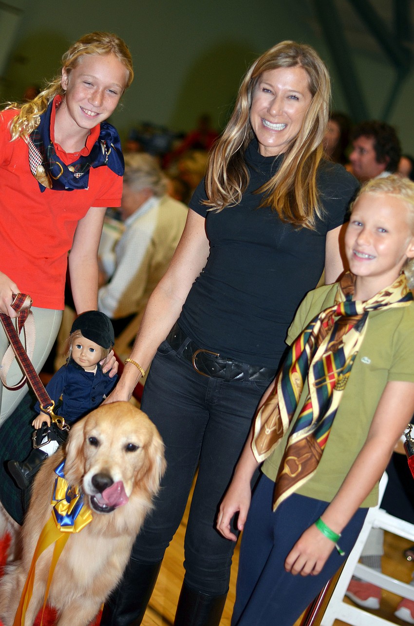 Lucy, Janet and Reagan Walter with Buck, the golden retriever