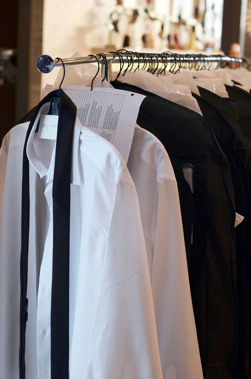 The 68 solemen for the 10th annual Wine, Women & Shoes event were fitted for their shirts at Saks Fifth Avenue Thursday, Oct. 23, during the WWS Soleman Reception.