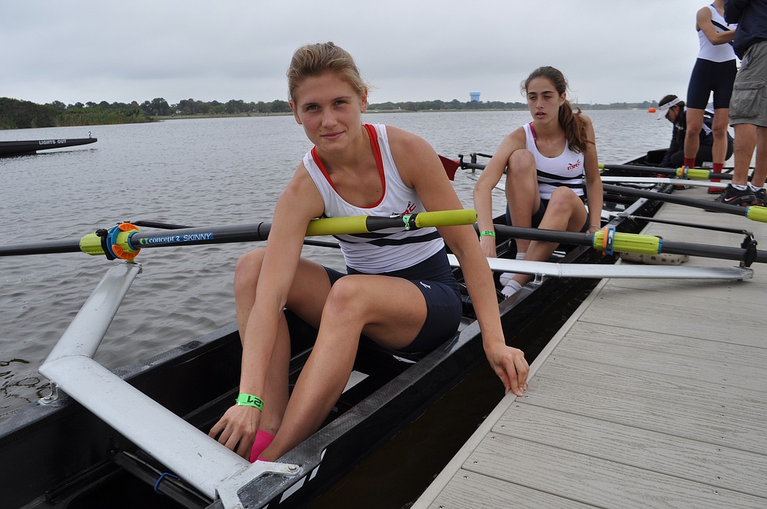 Liza Ray, of the Miami Rowing Club, pushes off for the lightweight 4 race.