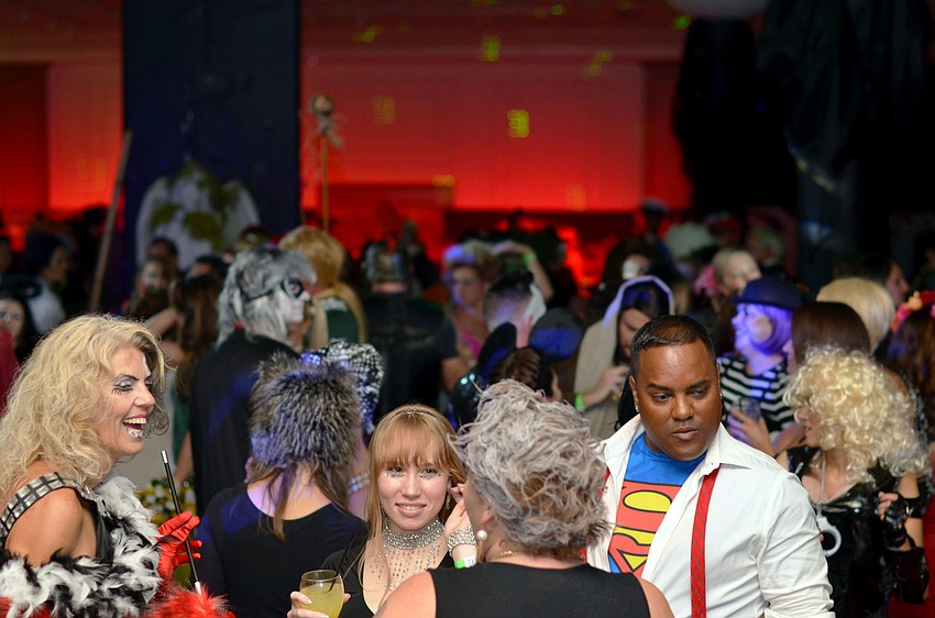 Guests dance to the sounds of DJ Undead at Safe Sex Halloween Bash â€˜Mightnight on the Bayou.â€™