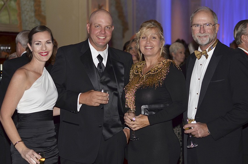 Jen and David Otterness with Vicki Reed and Lowe Morrison