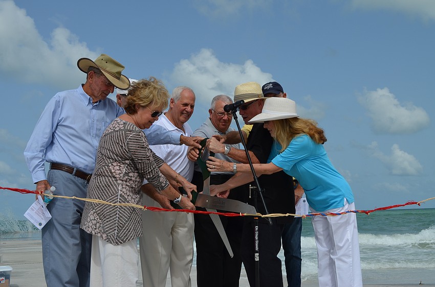 The Longboat Key Town Commission, including former Vice Mayor David Brenner, far left, cut the ribbon at the opening of the North Shore Road beach access Tuesday.