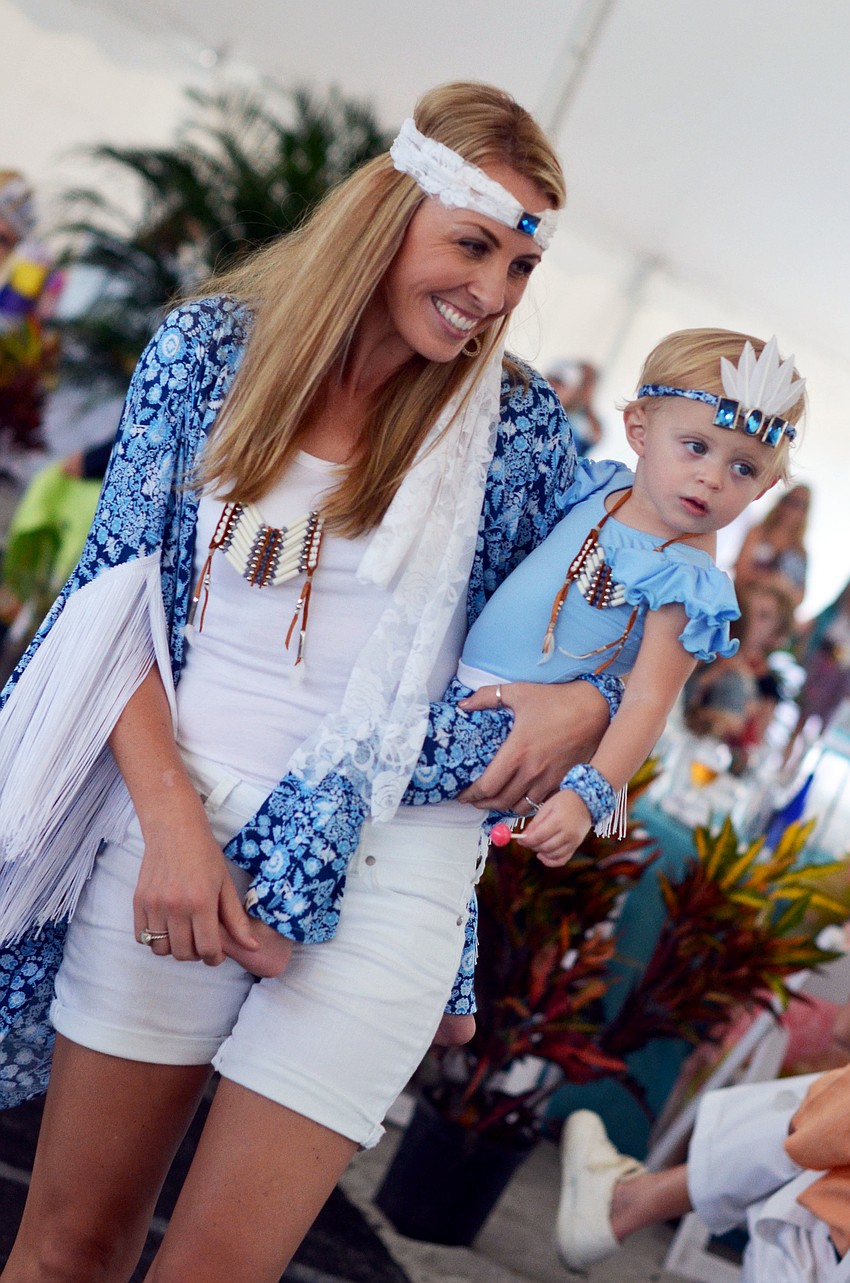 Ashley Gruters and her daughter Piper model in the Flip Flops and Fashion luncheon fashion show.