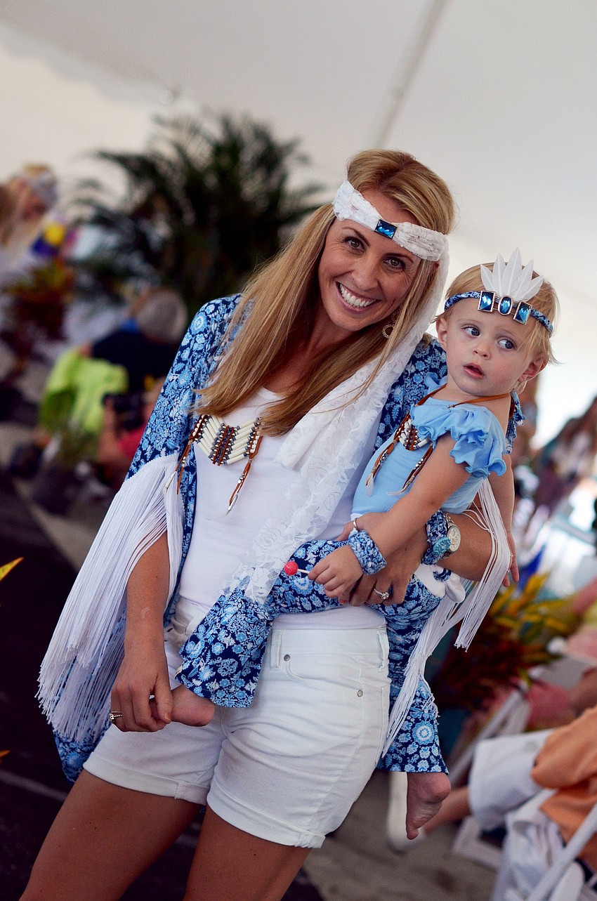 Ashley Gruters and her daughter Piper model in the Flip Flops and Fashion luncheon fashion show.