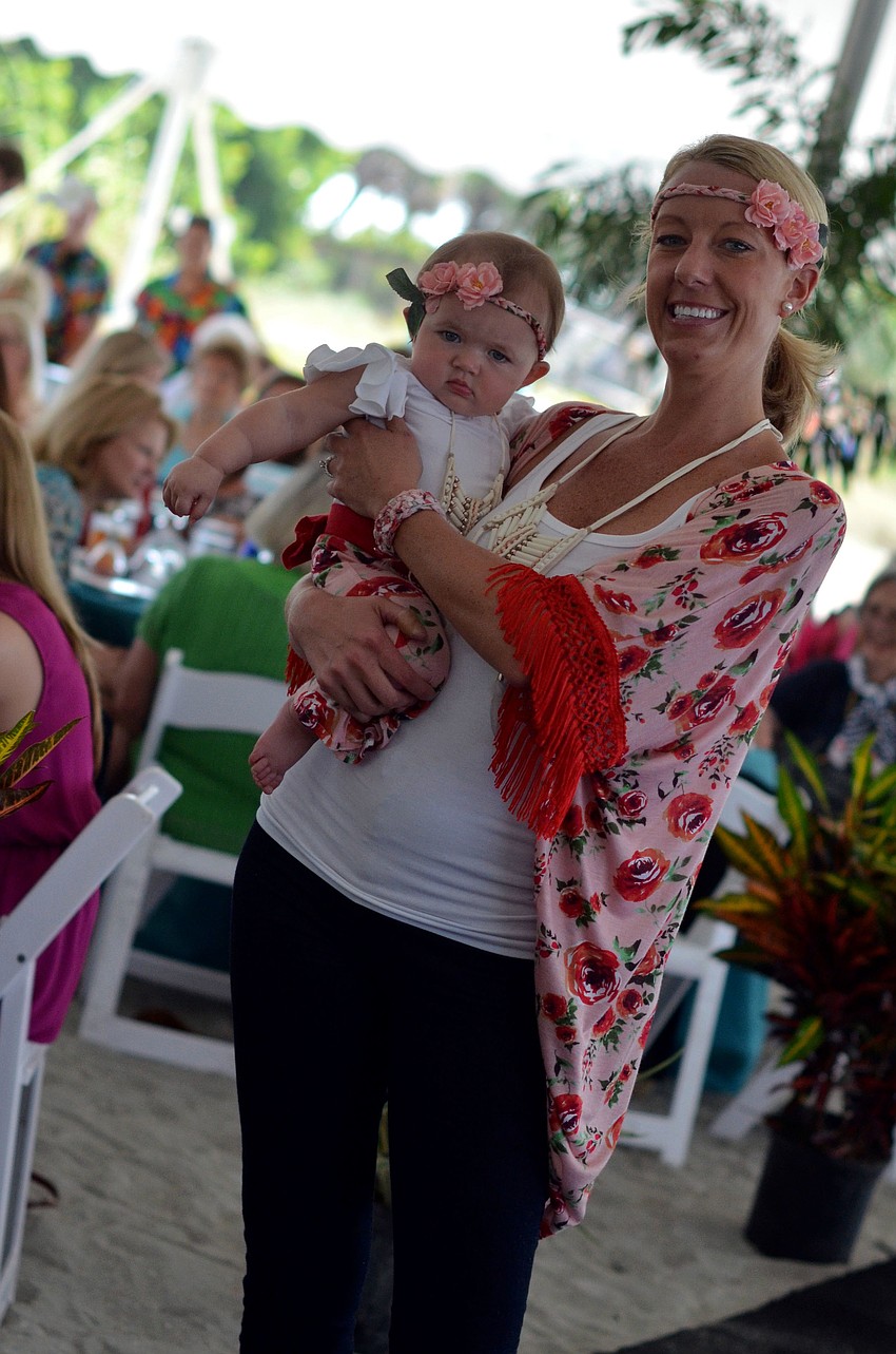 Erin Hart and her daughter Caroline model in the Flip Flops and Fashion luncheon fashion show.