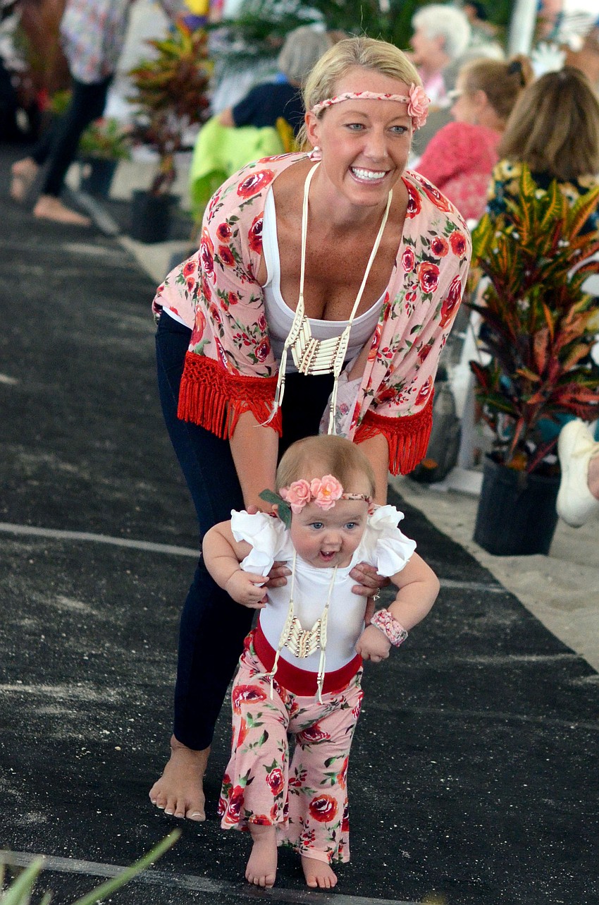 Erin Hart and her daughter Caroline model in the Flip Flops and Fashion luncheon fashion show.