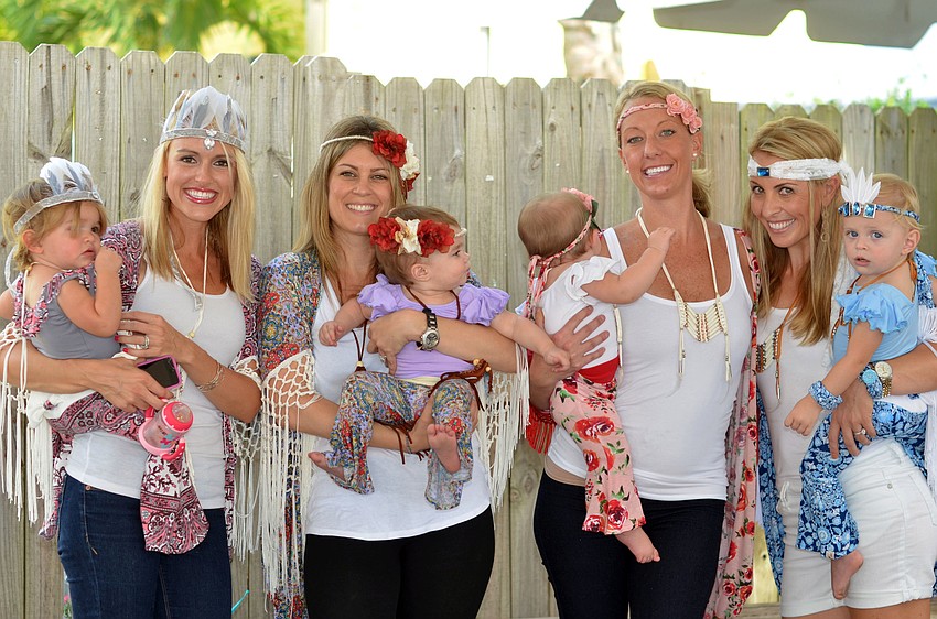 Models Montana Taplinger with her daughter Annabelle, Pandora Cabrera with her daughter Aspen Snyder, Erin Hart with her daughter Caroline and Ashley Gruters with her daughter Piper