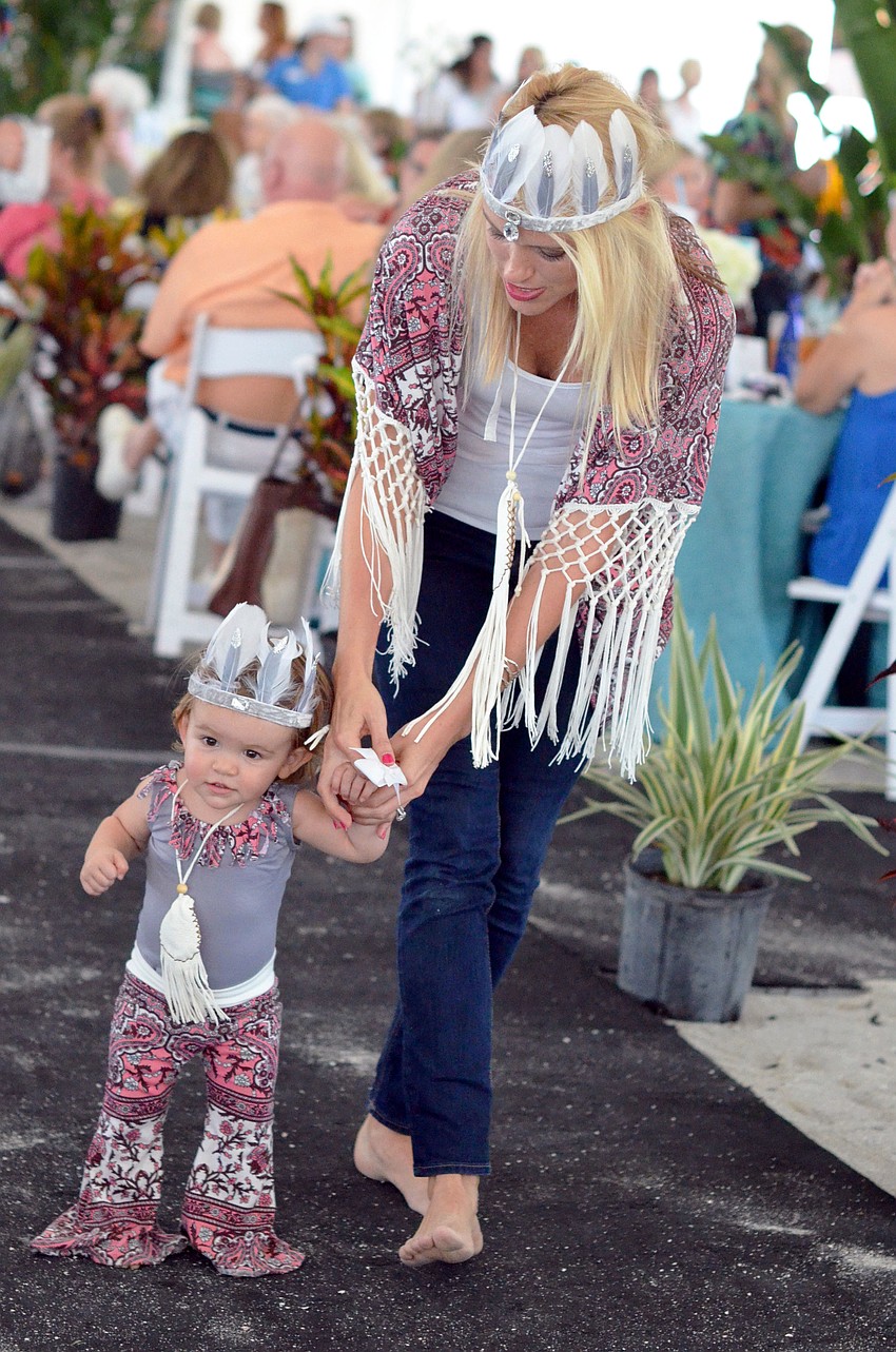 Montana Taplinger models in the Flip Flops and Fashion luncheon and fashion show with her daughter Annabelle