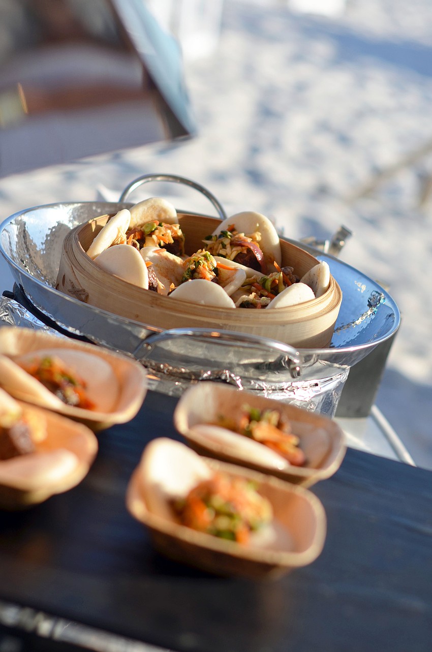 The Chefs at Longboat Key Club presented a variety of culinary offerings, such as braised short rib on Korean steam bum with kimchee slaw, at the 4th annual Bacchus on the Beach, Bacchanalian Beach Ball.