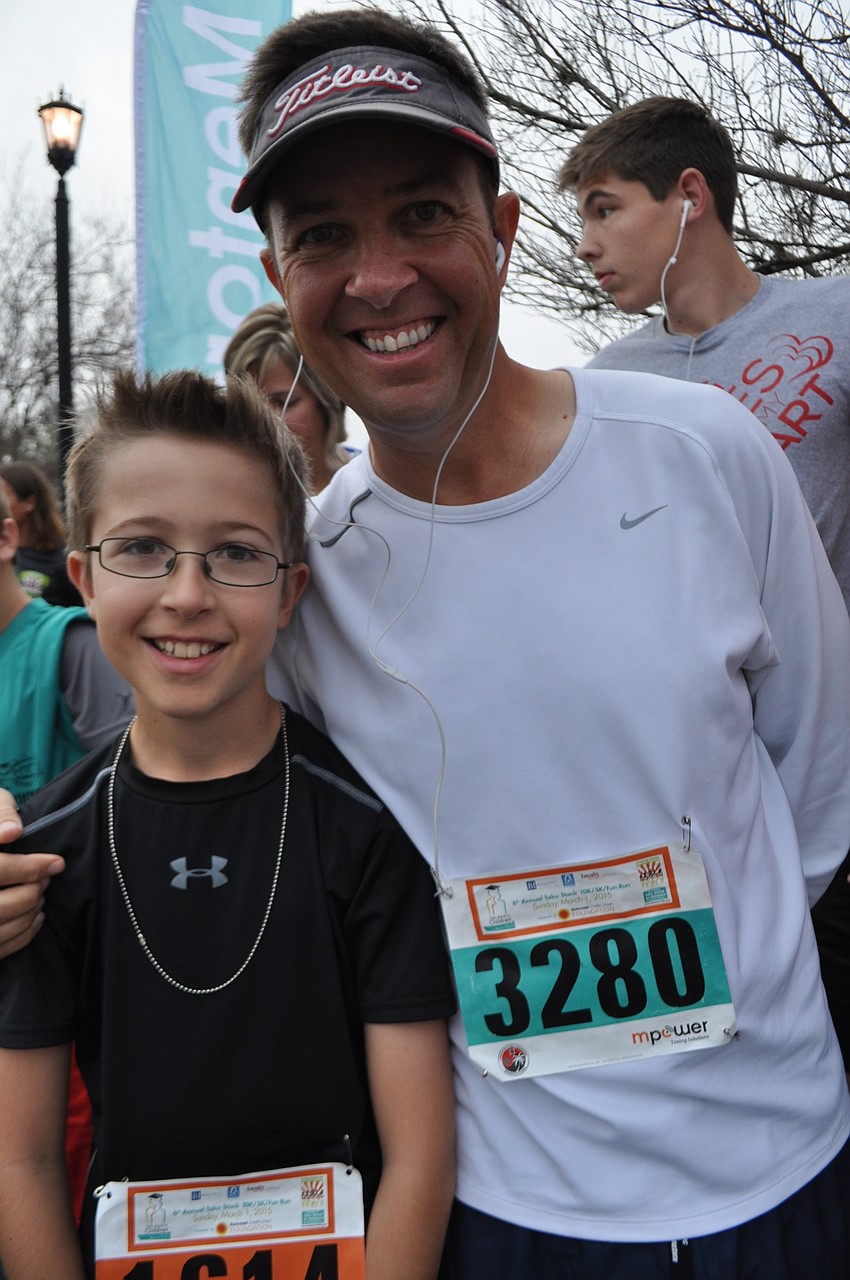 Chase and Shane Reiser listen to pre-race announcements.