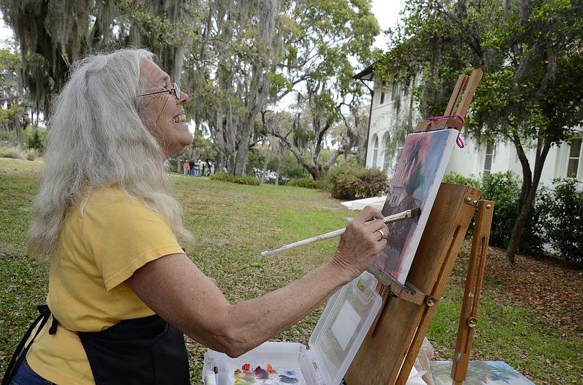 Judy Klein, a Sarasota resident and four-year member of the Light Chasers, paints near the Edson Keith Mansion.