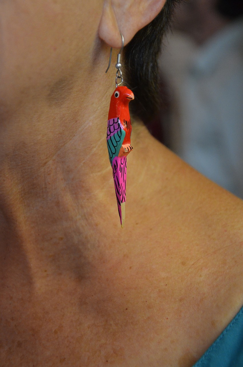 Barb Zdziarski donned her festive parrot earrings for the Alliance's theme.