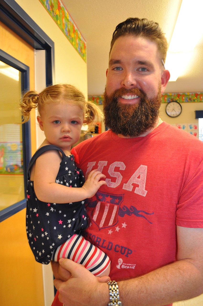 Lily Brumenschenkel hangs out with her dad, Josh, pre-parade.