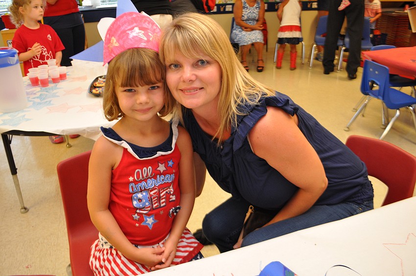 Kylie Didion, 5, enjoys cookies with her mom, Dorie.