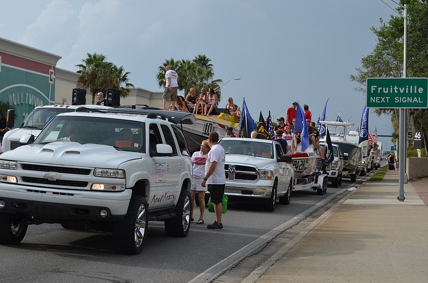 Powerboats lined up on Washington Boulevard wait to start the parade.