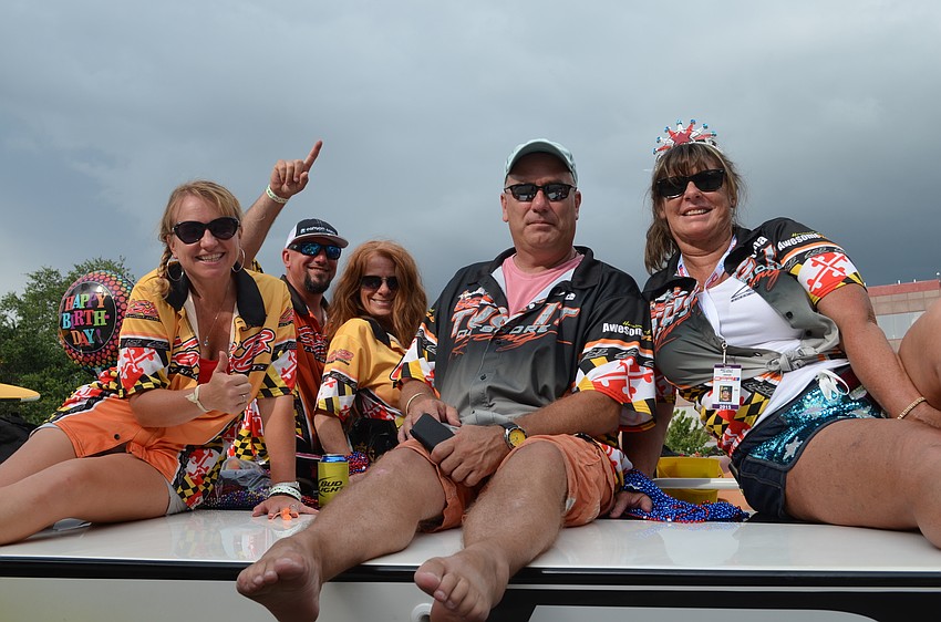 Kelly Keller, Kevin Smith, Shelly Illig, Tim Herten and Renee Lilly ride along in the parade.