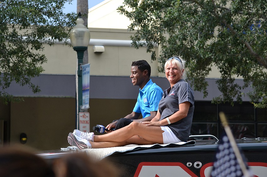 Festival Director Lucy Nicandri rides along in the parade.