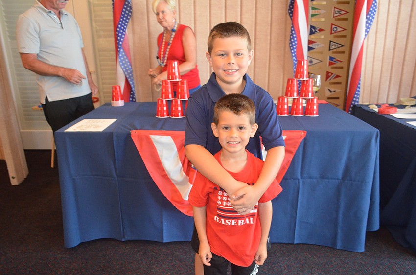 Eric Chalson, 8, with his brother, Dylan, 5