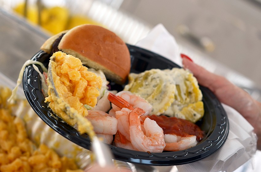Guests enjoy a buffet style dinner at the Siesta Key Chamber of Commerce's Fourth of July Fireworks Celebration VIP Party.