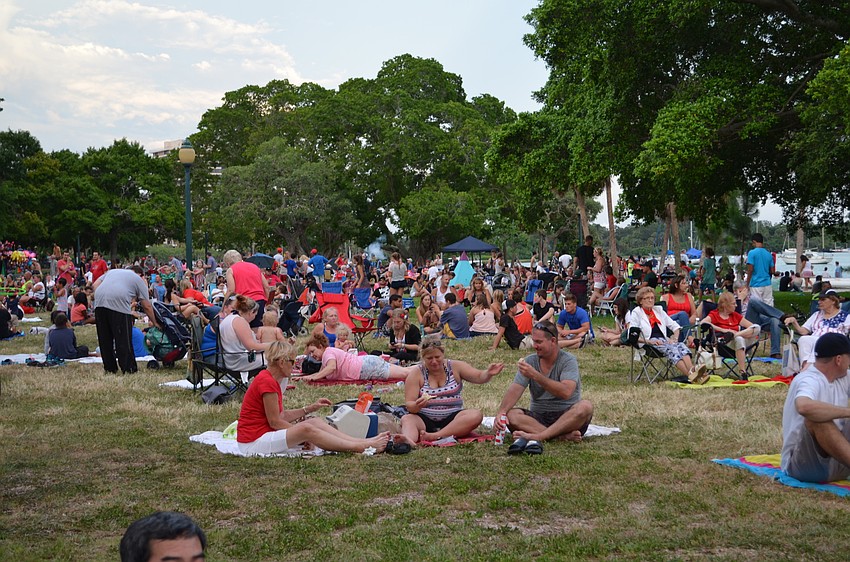 Residents set up picnics and tailgates along the bay and at Bayfront Park in anticipation for the fireworks show.