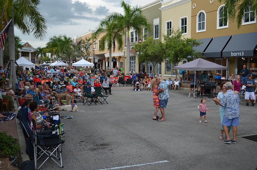 Music lovers dancing to the music at Music on Main this 4th of July weekend