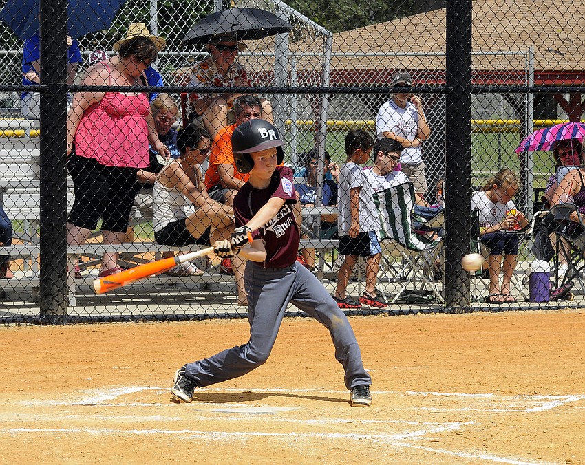Braden River Little League 9/10 All-Star Kyle Vaughn notches a hit versus Manatee National.